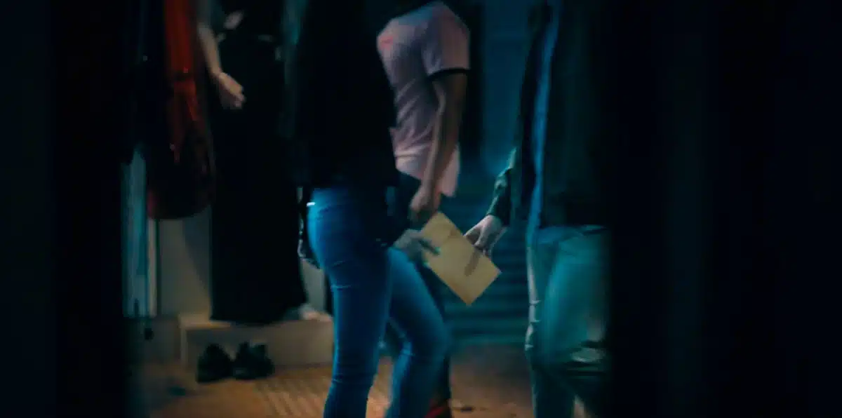 Operate Man and woman passing classified folder